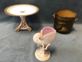 A C19th Royal Worcester glazed nautilus vase with a coral and seaweed moulded base; a Victorian