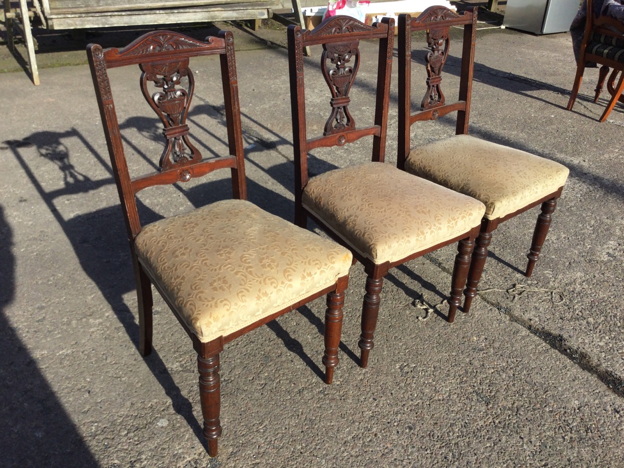 A set of three Edwardian mahogany chairs with carved arched backs and pierced vase foliate carved - Image 3 of 3