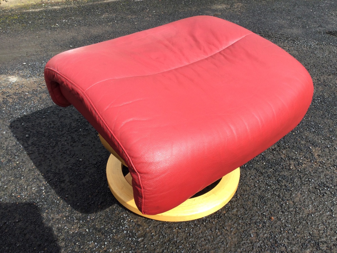 A stressless style leather armchair and footstool, with panelled upholstery and loose cushions, - Image 3 of 3