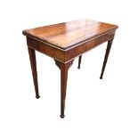 A Georgian mahogany fold-over card table with moulded rectangular top on swing legs enclosing a