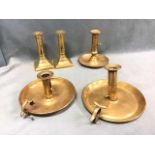 A pair of Georgian brass columnar candlesticks on flared square bases - 5.25in; and three nineteenth