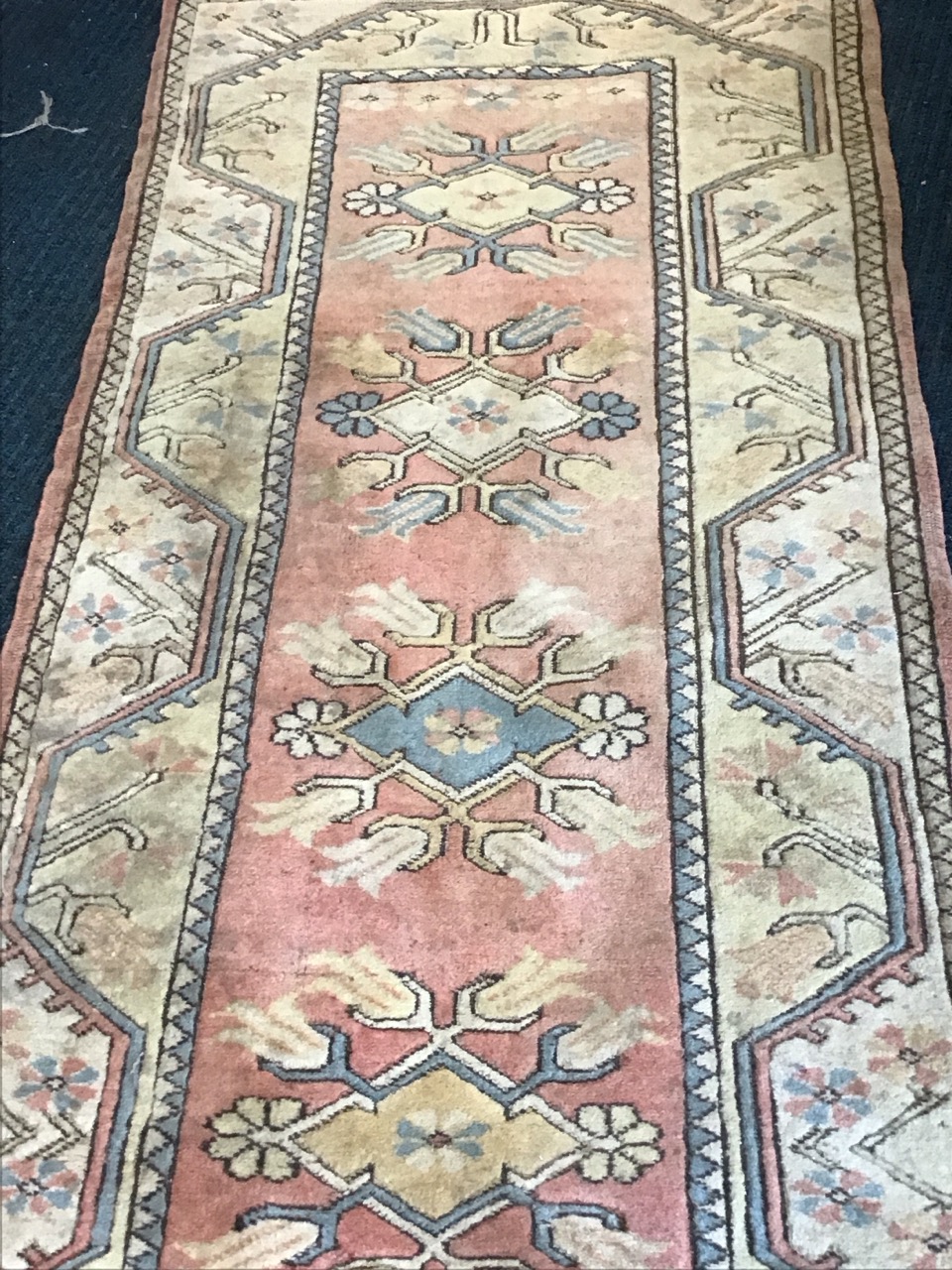 A Turkish wool runner with floral lozenges on a pink field within stylised meandering floral - Image 3 of 3