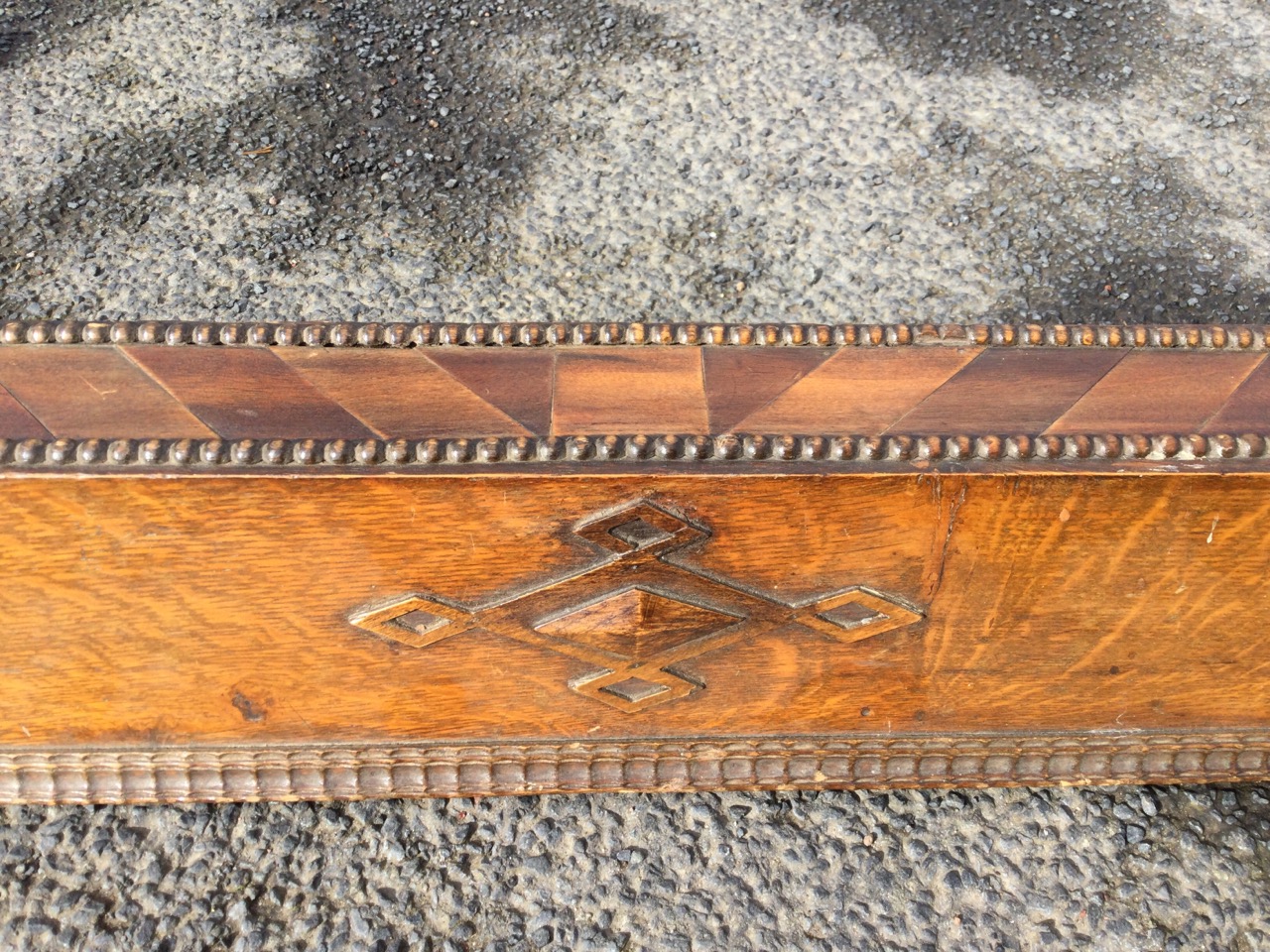 A heavy oak fender with chevron marquetry band framed by beading above an angled apron with ripple- - Image 2 of 3