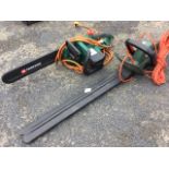 A Black & Decker 500w electric hedgecutter with long cable; and a Parkside electric chainsaw. (2)