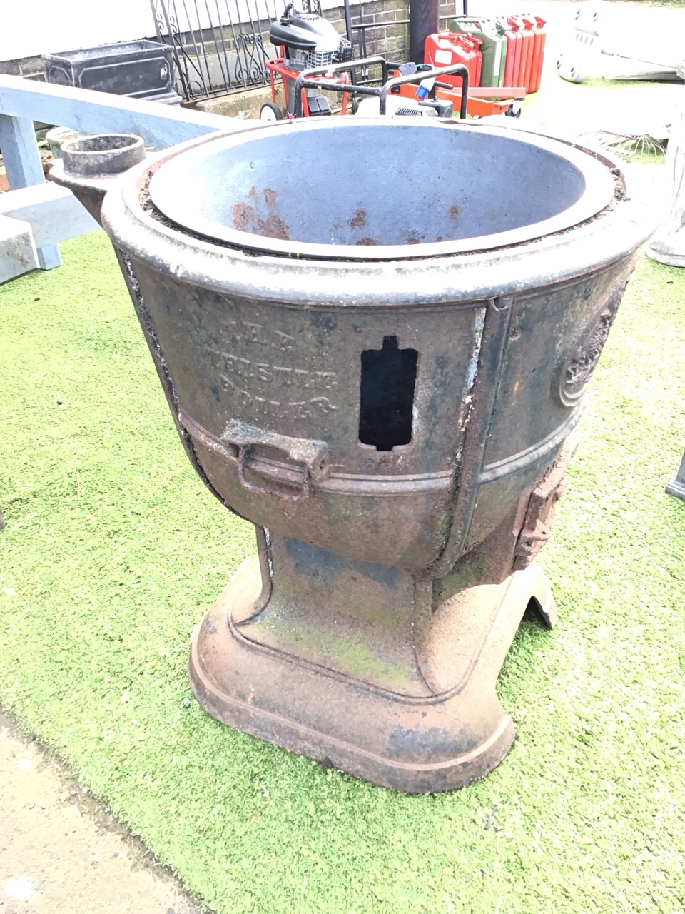 A Victorian cast iron boiler - The Thistle, with cauldon shaped flat rimmed vessel having copper tap - Image 2 of 3