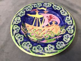 A Maling ceramic tubelined rack plate decorated in the galleon pattern - unmarked. (11.25in)