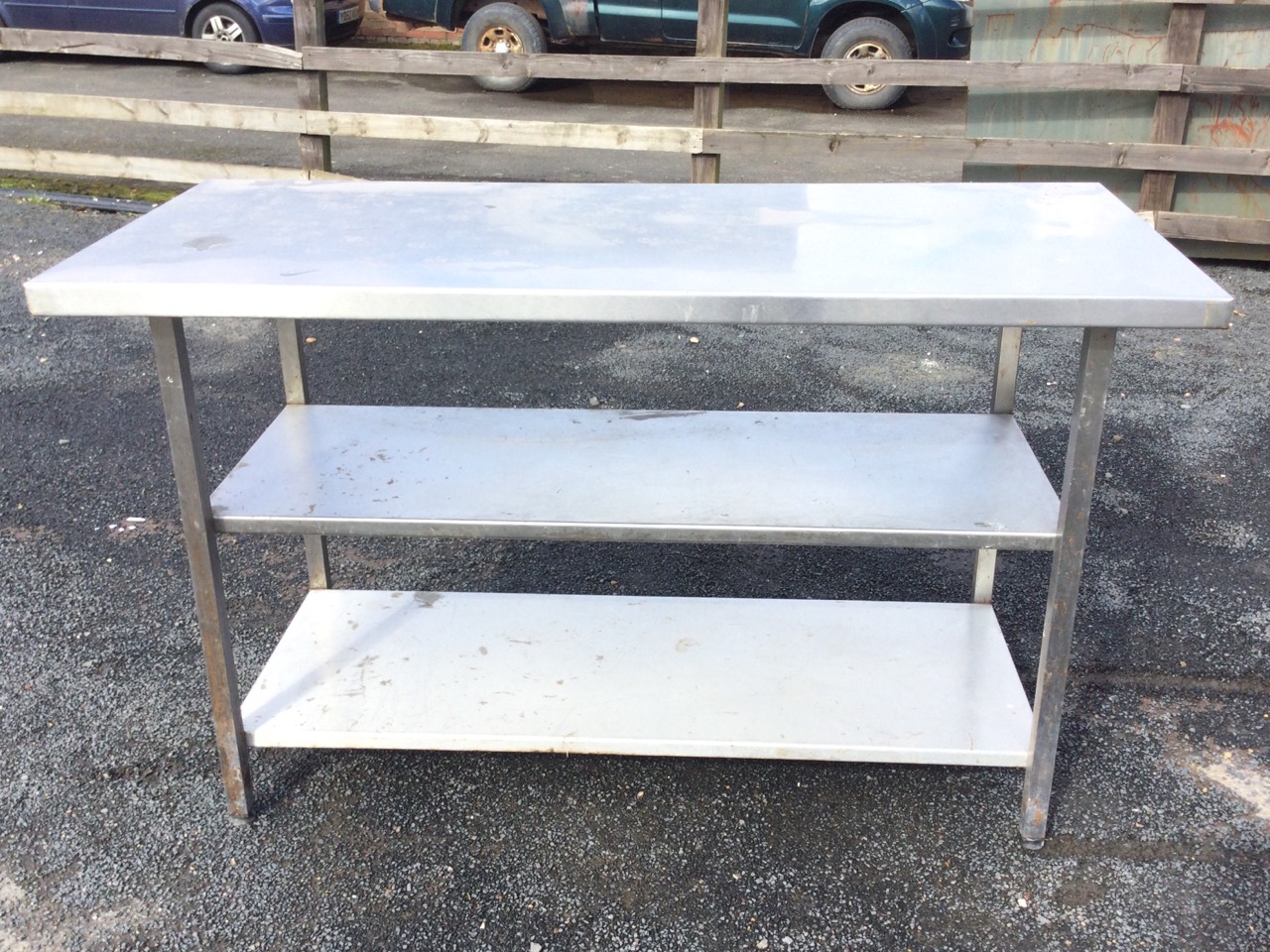 A rectangular stainless steel counter with platform top and two shelves below, supported on square - Image 2 of 3