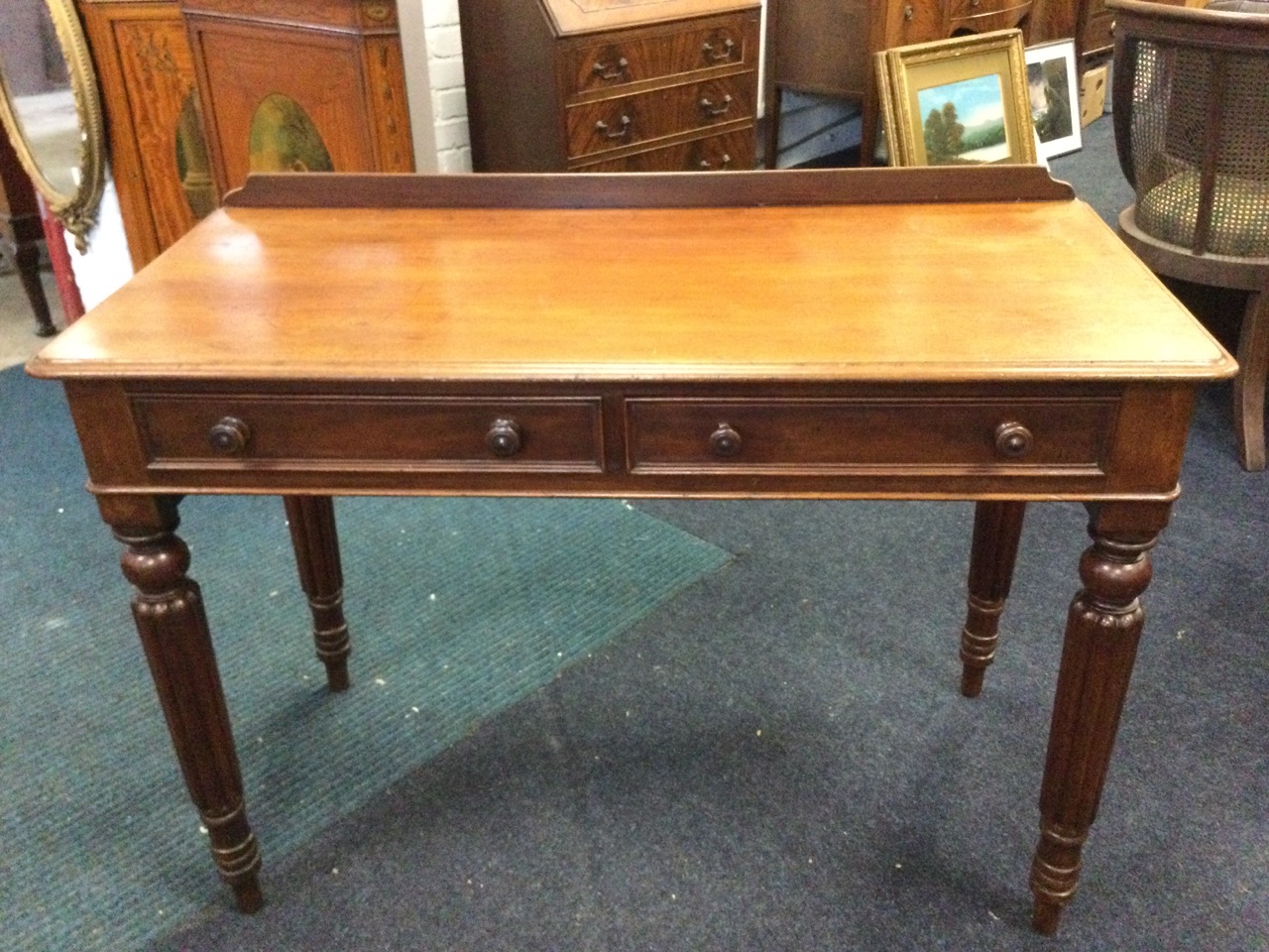 A Victorian mahogany side table, the low back above moulded top with two knobbed drawers, raised - Image 2 of 3