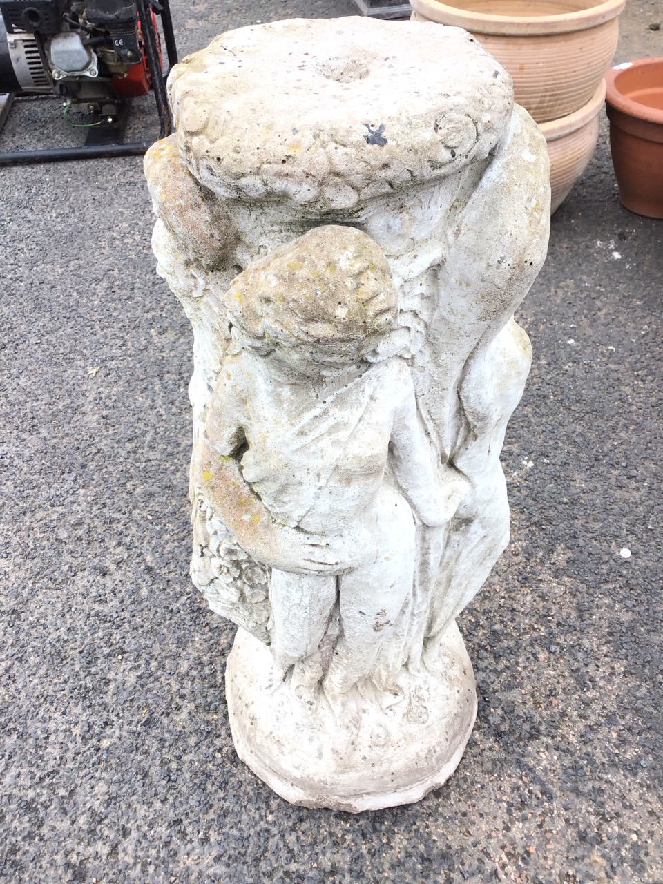 A composition stone birdbath support cast as three ladies around a flower encrusted column, on - Image 2 of 3