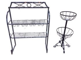 A painted metal garden plant plantpot stand with two rounded wirework shelves on tubular frame