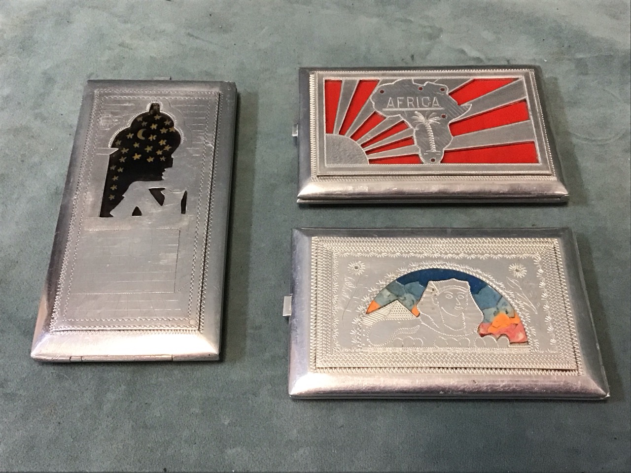 Three 40s Egyptian aluminium cigarette boxes, with pierced, painted and engraved decoration - one - Image 2 of 3