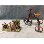 A painted cast iron mechanical boy scout camp moneybox cast with figures and foliage - 10in x 6in: