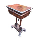 A Victorian rosewood teapoy with rectangular fretwork carved tapering hinged compartment -