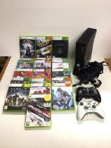 An Xbox 360 games console with AC adapter, two controllers & eighteen game discs including Halo
