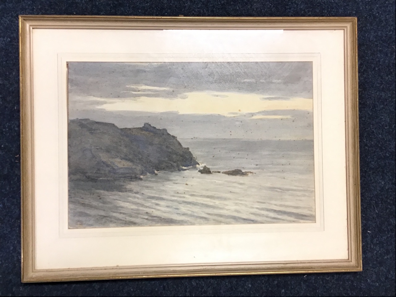 CB Philips, watercolour, calm seascape with rocky headland at dawn, signed & dated, mounted &
