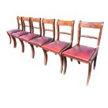 A set of six regency style mahogany dining chairs with ribbed tablet backs and ropetwist joining
