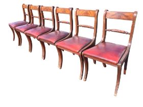 A set of six regency style mahogany dining chairs with ribbed tablet backs and ropetwist joining