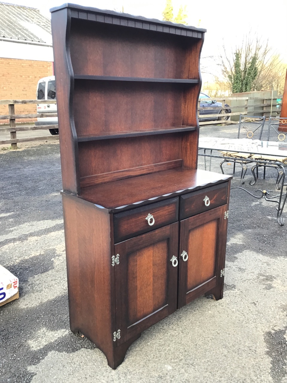 A stained oak dresser, the notched cornice and dentil apron above shelves flanked by shaped sides - Image 2 of 3