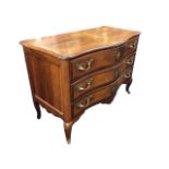 A C18th Italian serpentine fronted walnut commode, probably Piedmontese, with moulded rosewood