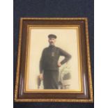 An Edwardian three-quarter length handcoloured photograph of a Boulmer fisherman, the proud figure