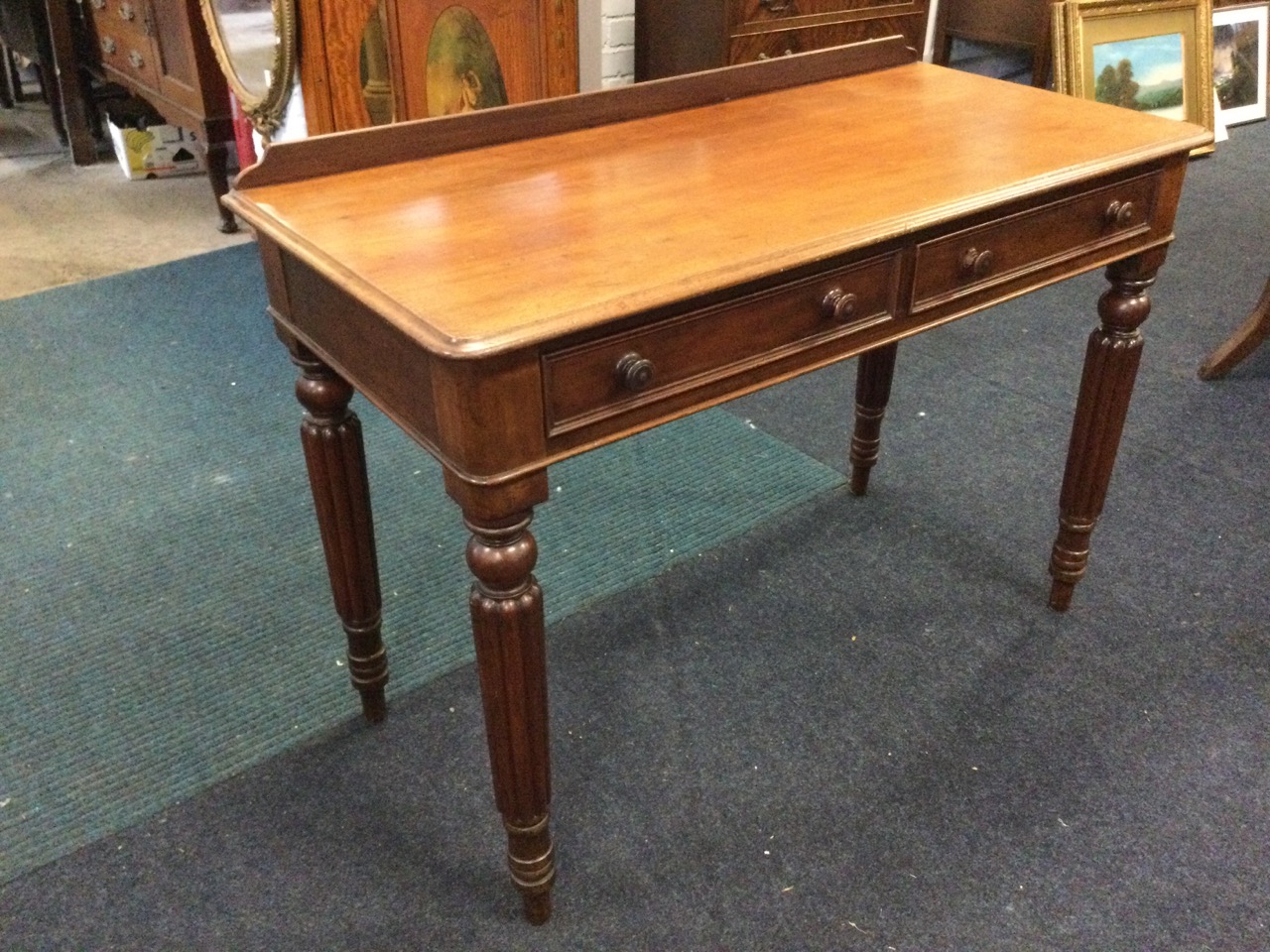 A Victorian mahogany side table, the low back above moulded top with two knobbed drawers, raised - Image 3 of 3