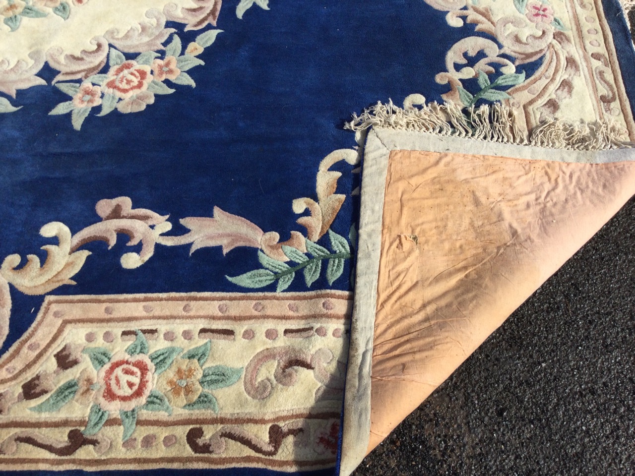 A rectangular Chinese aubusson style rug with central floral medallion on a deep blue ground - Image 2 of 3