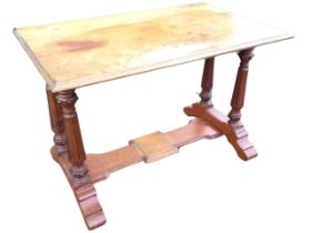 A Victorian mahogany table with moulded rectangular top on turned, fluted and beaded column legs,