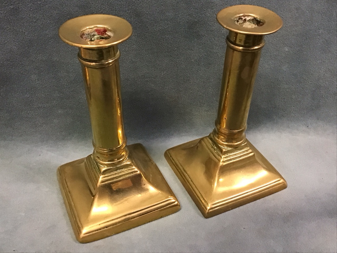 A pair of Georgian brass columnar candlesticks on flared square bases - 5.25in; and three nineteenth - Image 2 of 3