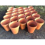 Twenty-five terracotta tapering plant pots with moulded rims. (12.25in) (25)