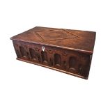 A rectangular oak bible box with lozenge carved cover and arcade chiselled frieze with bone