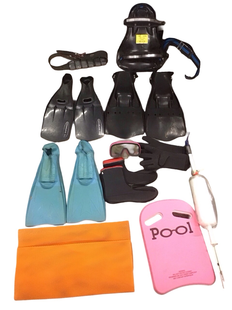 Miscellaneous diving equipment including a Namron scuba tank harness, a floater board, a pair of