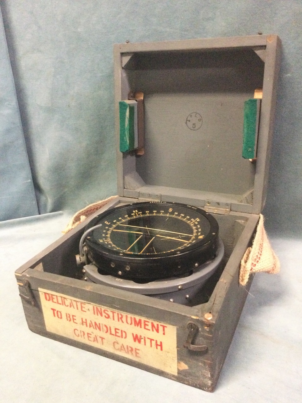 A cased gimbal mounted wartime ships compass, the type P4A instrument in working condition. (6.5in