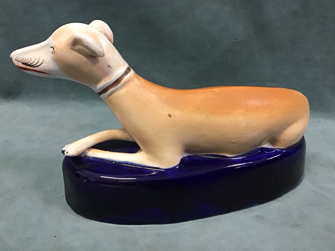 A Staffordshire ceramic inkwell in the form of a recumbent greyhound on an elliptical blue glazed - Image 3 of 3