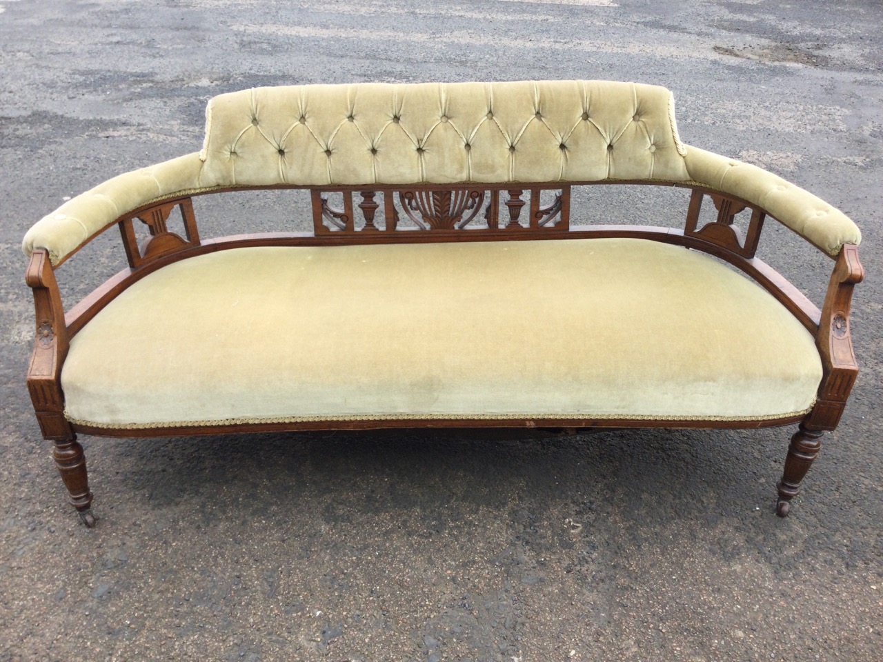 A Victorian walnut sofa with button upholstered back and rounded arms on carved pierced splats, - Image 2 of 3
