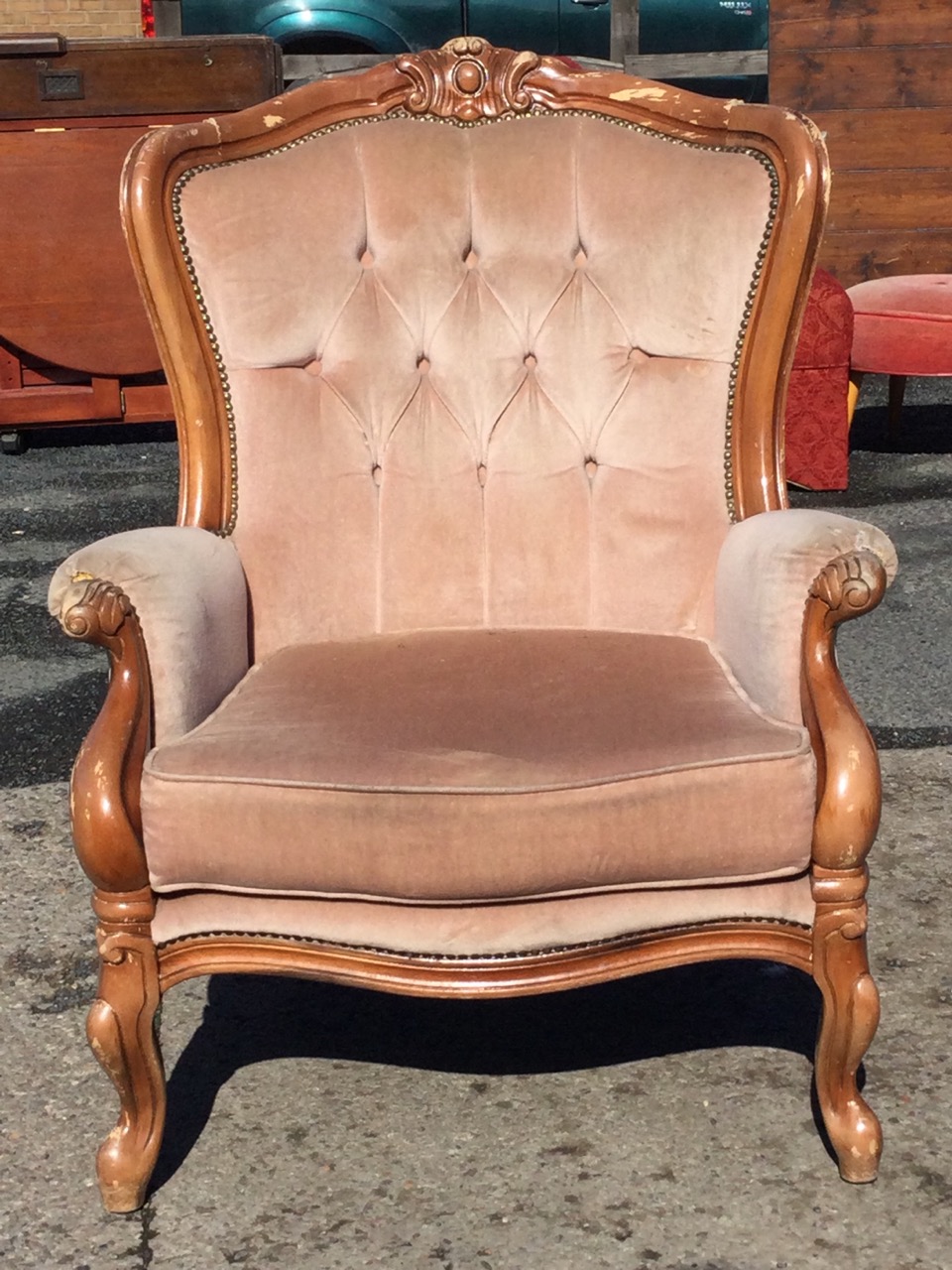 A Victorian style upholstered armchair with carved crestrail and buttoned back above a seat with - Image 2 of 3
