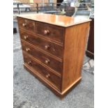 A Victorian mahogany chest of drawers with moulded top above two short and three long knobbed