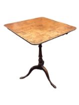 A George III yew occasional table with rounded square top above a baluster turned column, raised