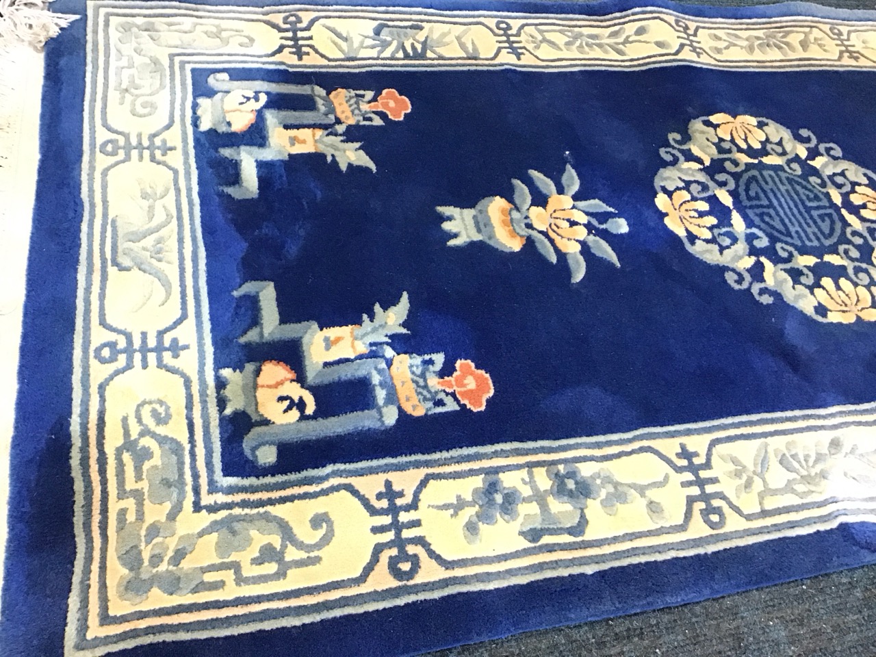 A Chinese wool carpet with central floral Shou medallion on a blue field with plantpots, braziers - Image 3 of 3