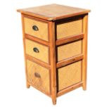 A pine & cane chest of drawers with three graduated cane drawers mounted with metal cup handles