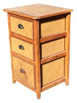 A pine & cane chest of drawers with three graduated cane drawers mounted with metal cup handles