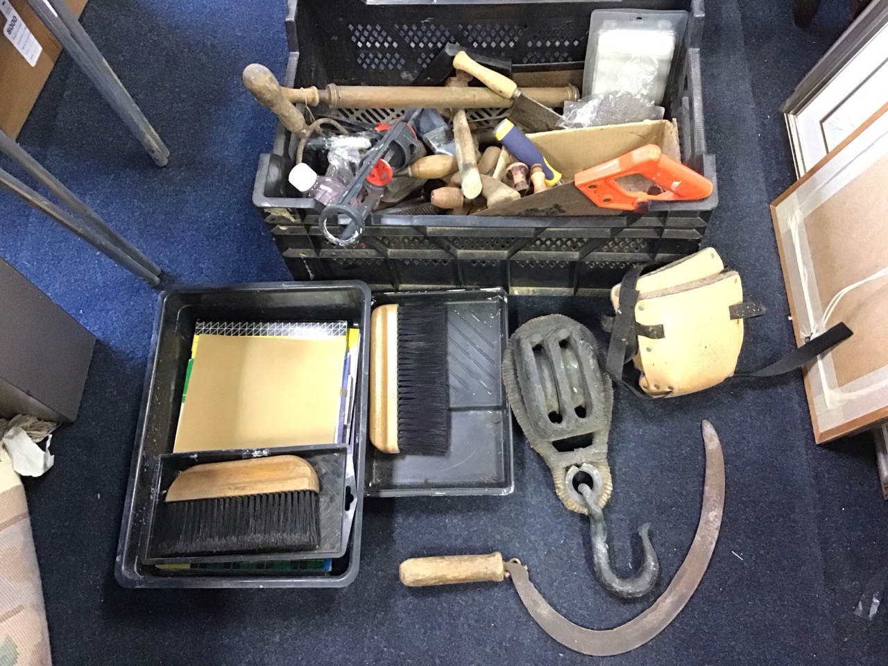 Miscellaneous tools including a double pulley block, a sickle, a drill, a axe, a brass pumped spray,