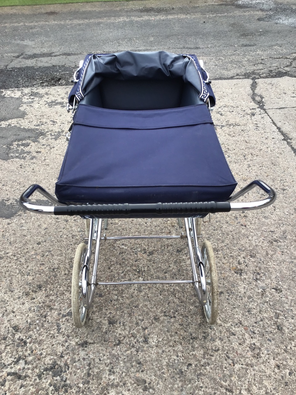 A Mothercare traditionally styled pram, the lined body with folding canvas hood, on a chromed - Image 3 of 3