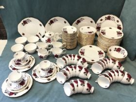 An extensive Colclough porcelain dinner & tea service decorated with roses - plates, cups & saucers,