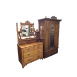 An Edwardian mahogany CWS Pelaw wardrobe and dressing table, the robe with pediment and moulded
