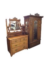 An Edwardian mahogany CWS Pelaw wardrobe and dressing table, the robe with pediment and moulded
