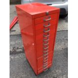 A painted metal collectors cabinet of fifteen drawers mounted with chromed label loop handles, on