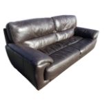 A contemporary Violino three-seater leather sofa with rectangular back and seat flanked by sloped