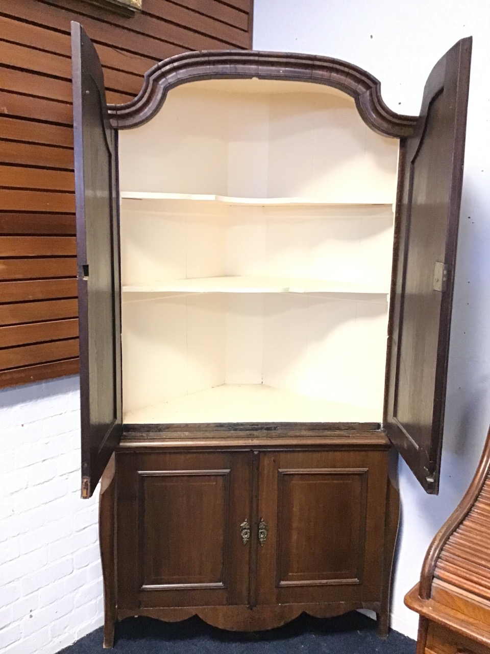 A C18th Dutch corner cabinet with shaped arched cornice above a pair of panelled doors with - Image 2 of 3