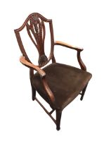 An Edwardian mahogany Hepplewhite style armchair, the shield shaped back with carved pierced splat