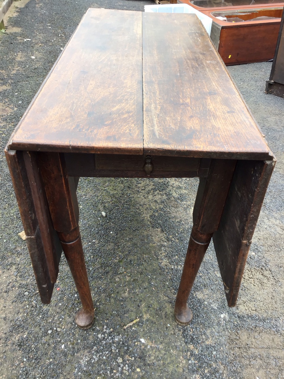 A Georgian oak dropleaf dining table, the rectangular top with two leaves opening on swing legs, - Image 3 of 3